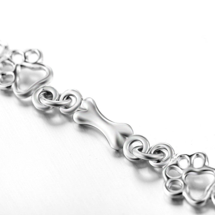 Pulsera con Patas de Perro Colgantes y Hueso de Plata Sin Tratamiento, Edición Limitada