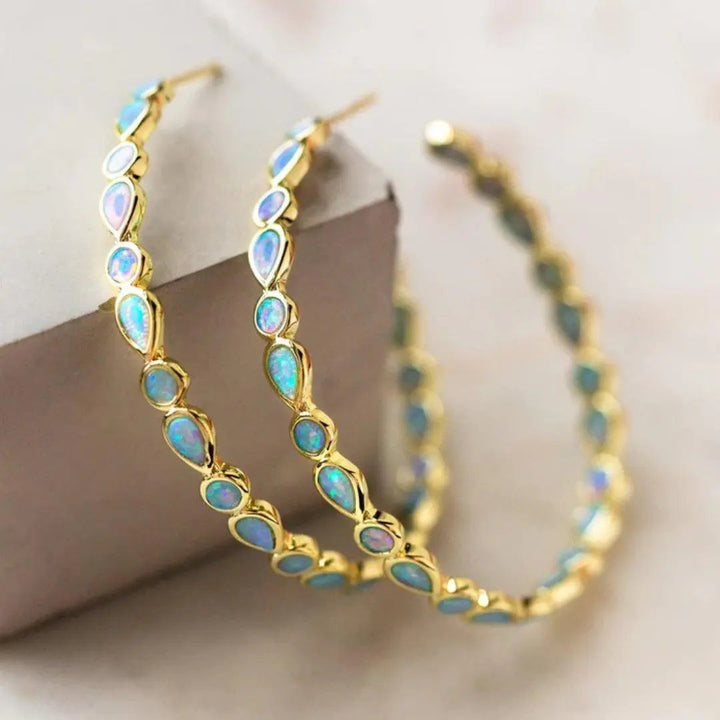 Pulseras retro de oro con ópalo azul