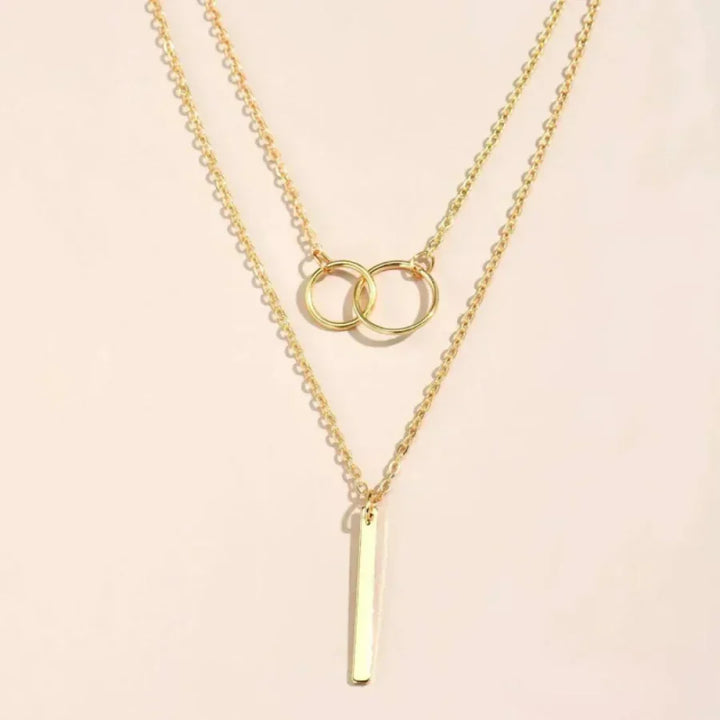 Collar retro dorado con colgante circular doble