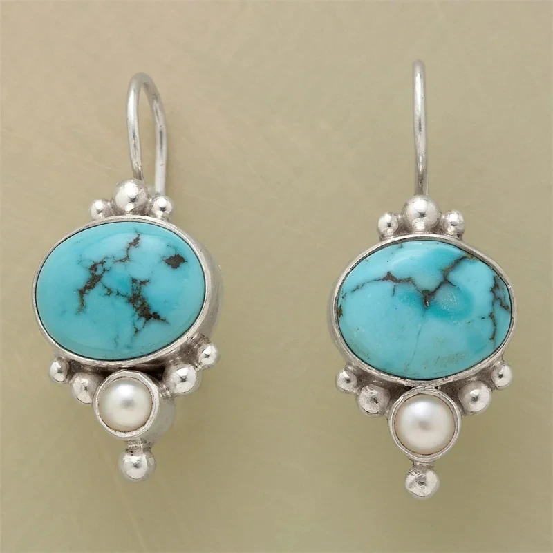 Pendientes vintage con piedra azul y margaritas